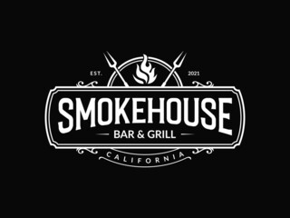 Vintage smokehouse bbq barbecue barbeque bar and grill logo design with fork and fire - obrazy, fototapety, plakaty