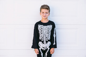 Kid with Halloween skeleton makeup