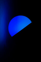 Blue light in the dark. Room lamp in the bedroom. The blue color of the light source.