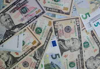 Fototapeta na wymiar dollar and euro bills. lots of banknotes