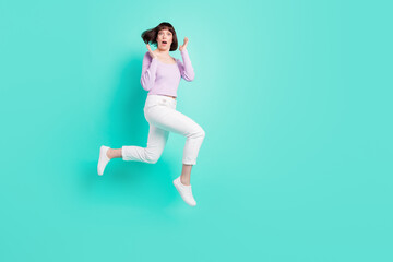 Fototapeta na wymiar Full length body size photo woman shocked amazed jumping up isolated bright teal color background