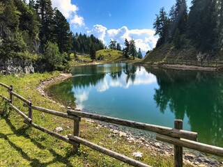 Fototapeta na wymiar Alpine Pond around Rofan Mountains in Maurach 