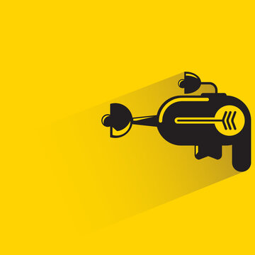 space gun with shadow on yellow background