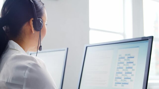 Diverse team of professionals is working in the phone support office. Working day of sales managers in the call center. Concept of business, telephone consulting and problem solving.