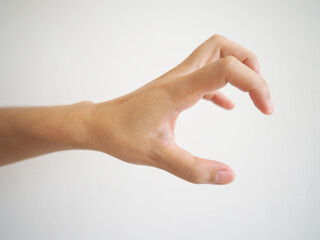 Asian hand muscle spasm . disorder of one hand. abnormally bent fingers on a white background.