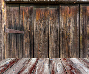 Wooden plank flooring. Plank floor. The wall is covered with a board. Grunge background. Vintage.