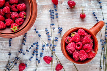 raspberry composition with dry lavender rustic background top view