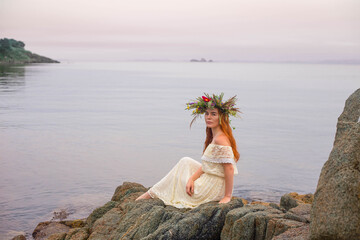 the girl in the wreath behind the sea