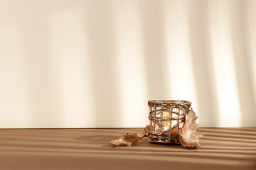 Autumn minimalist composition and an empty pedestal on a brown table with window shadows