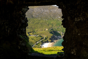 View on Keem beach from a window of an old building. Achill island, county Mayo, Ireland.