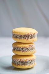 Traditional Argentinian alfajores with dulce de leche on marble table. Argentine gastronomy concept.