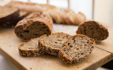 fresh loaf of bread on wooden board