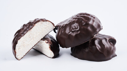 Marshmallow in chocolate glaze close up isolated on white background, clipping path