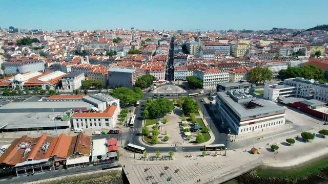 Aerial drone view over the Square Duque da Terceira and the Alecrim Street, in Cais do Sodre, sunny Lisbon