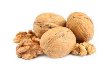 Pile of ripe walnuts on white background
