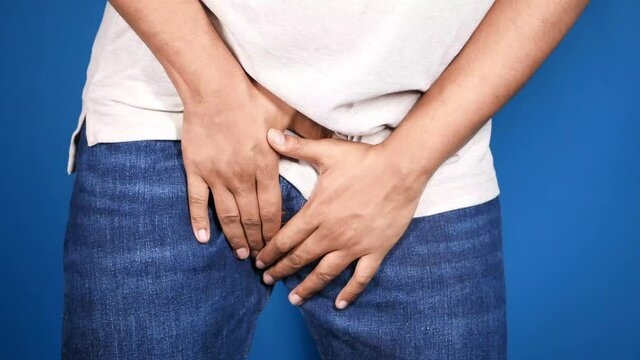 the concept of prostate and bladder problem, crotch pain of a young person 