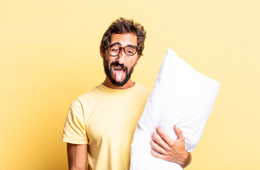 expressive crazy man with cheerful and rebellious attitude, joking and sticking tongue out and...
