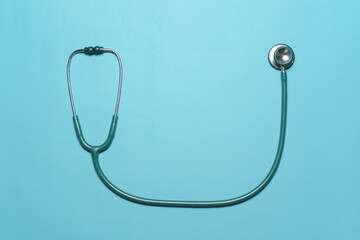 Blue Stethoscope against blue background