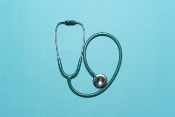 Blue Stethoscope against blue background