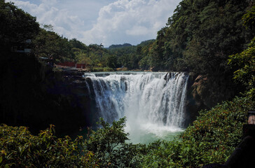 Fototapeta premium Waterfall between mountains in Taiwan