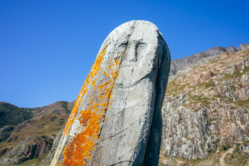  Altai balbal. The face on the stone. Russia, the Altai Republic. An ancient image on a stone.The...