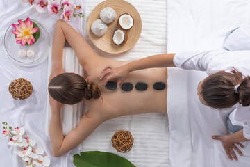 Woman at spa stone massage