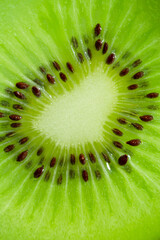 Kiwi Macro,slice of kiwi fruit on a full frame. horizontal format