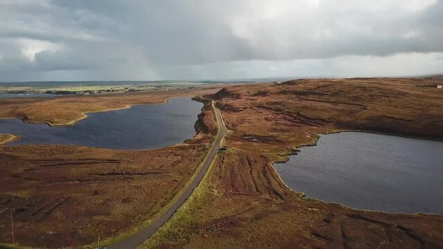 4K Aerial view of empty road with one car, Thurso, Dunnet Head, Scotland.