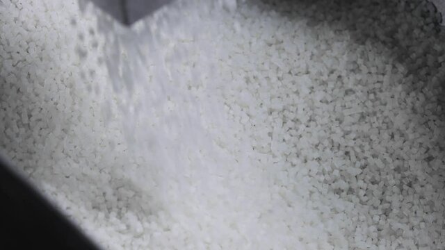 Plastic granules fill the tank for further sorting. Copound