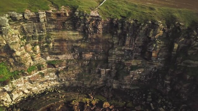 4K Aerial shot of the dramatic coast line of Scotland. Dunnet Head.