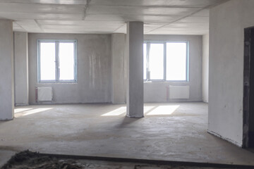 construction site, large space with windows, no renovation