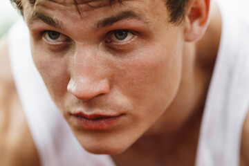 Young white runner working out on playground outdoors