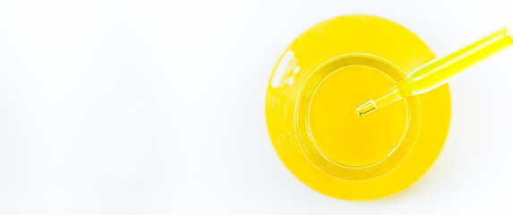Macro yellow science experiment glass tube,Pipette with liquid biological material. Laboratory concept.