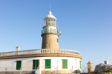 Fototapeta na wymiar Corrubedo lighthouse in the Atlantic Ocean, Galicia, spain