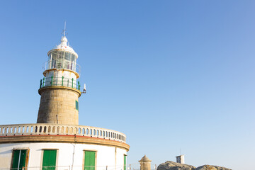 Fototapeta na wymiar Corrubedo lighthouse in the Atlantic Ocean, Galicia, spain