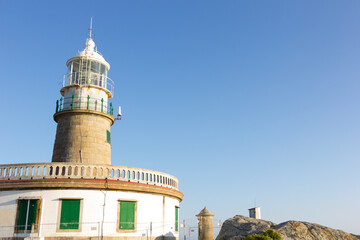 Obraz premium Corrubedo lighthouse in the Atlantic Ocean, Galicia, spain