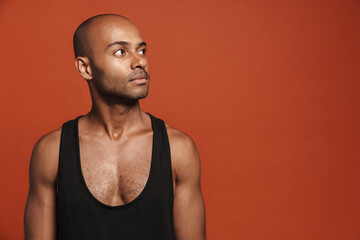 Black young man wearing shirt posing and looking aside