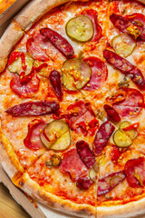 Hot and spicy Italian pepperoni pizza in flat lay. Delicious fast food for dinner