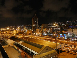 Fototapeta na wymiar Night view of Haifa, Israel, in the middle of the famous sail tower with the government offices