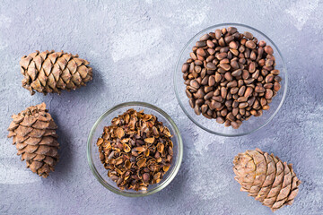 Pine nut shells in a bowl, ready for decoction on the table. Alternative medicine. Top view