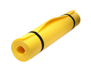 Rolled yellow camping mat isolated on white
