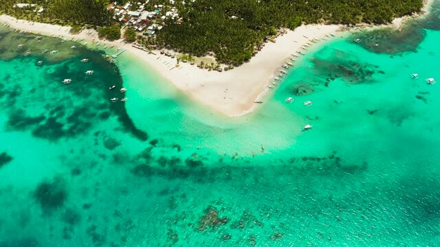 Sand beach and tropical islands, palm trees by atoll with coral reef, top view.Daco island, Philippines. Summer and travel vacation concept