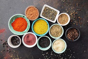 spices and herbs for cooking. Sumac, pepper, paprika, rosemary, khmelisuneli, cloves and more fresh portion ready to eat meal snack on the table copy space food background rustic. top view