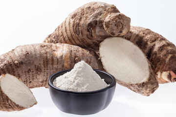 Taro Root of Colocasia esculenta and Organic Taro Flour in a bowl