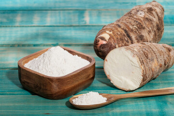 Taro Root of Colocasia esculenta and Organic Taro Flour in a bowl