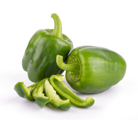 Group of fresh green bell peppers with slices isolated on a white background close up