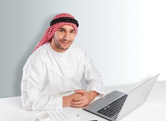 Saudi young arabian man holding a digital gadget
