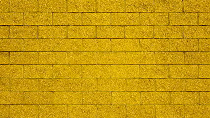 Yellow color brick wall texture.