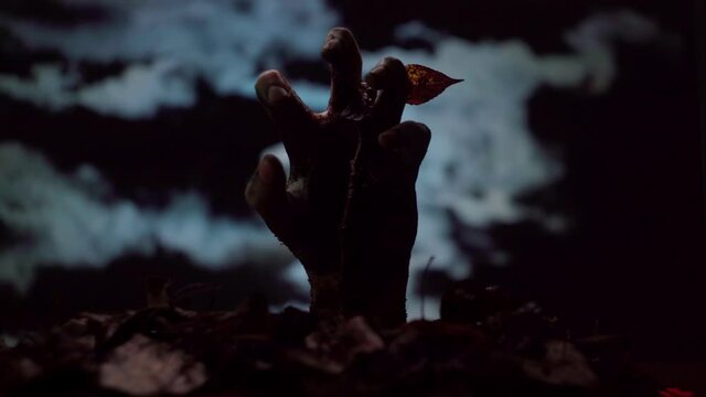 Zombie hand coming out of the ground