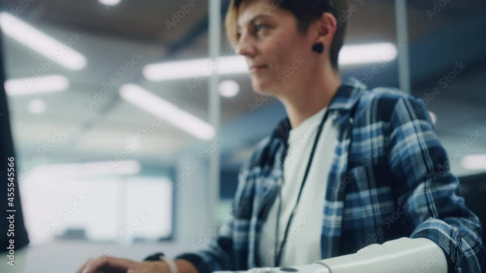 Aufkleber Diverse Body Positive Office: Woman with Disability Using Prosthetic Arm to Work on Computer. Professional with Futuristic Thought Controlled Myoelectric Bionic Hand. Tilt from Hand to Portrait